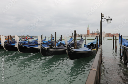 gondolas in the small port of Venice and in the background the Basilica of San Giorgio during high tide © ChiccoDodiFC