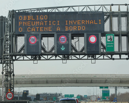 Italian Signal on the motorway that means obligation winter equiment photo