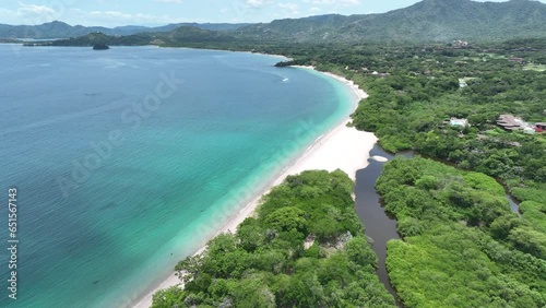 Playa Conchal, in Guanacaste, Costa Rica, is a stunning beach known for its unique seashell-covered shores, crystal-clear waters, and lush surroundings, perfect for a tropical escape. photo