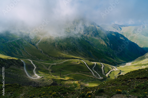 Mountain pass in Georgia in summer. Views from one of the most dangerous road on the world in Georgia. Road to Omalo.  Abano pass in the Caucasus mountains. Top view of winding road.