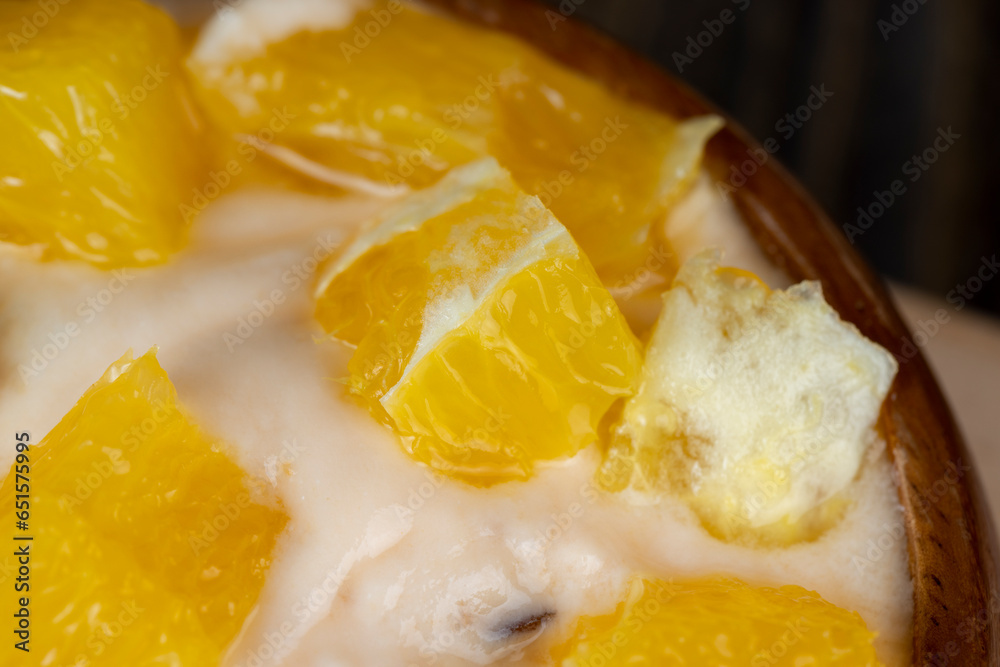 pineapple yogurt with slices of ripe yellow orange pineapple yogurt with slices of ripe yellow orange