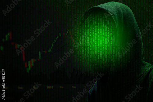 Crime cyber hacker in front of the matrix background.