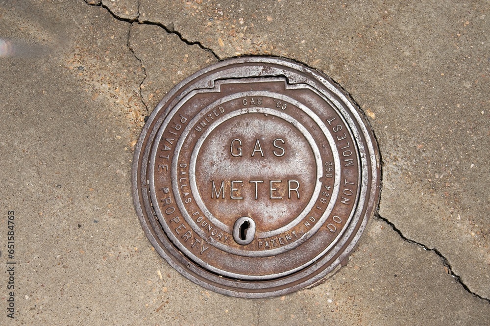 Various utility covers found on streets and sidewalks.