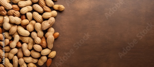 Isolated top view of unshelled peanuts on a isolated pastel background Copy space