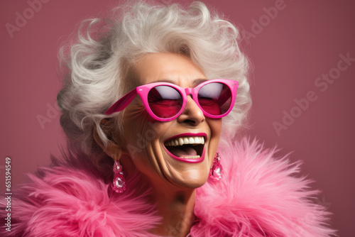 Old stylish woman senor lady in pink clothes smiling