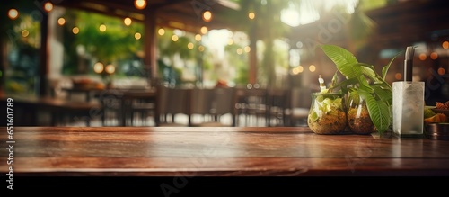 Blurry restaurant background with a table on top © AkuAku