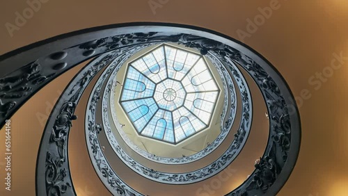 Cinemativc view of glass dome and spiral stairs in Vatican Museum, Rome, Itlay photo
