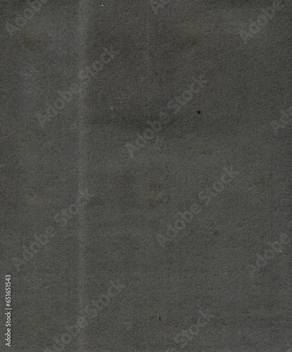 A high-quality scan of old black album paper that could be used as a texture or background. (ID: 651651543)