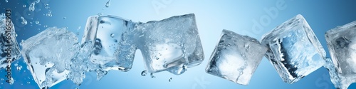 Pieces of ice and water on blue background. © MDMOHAMMODULAH