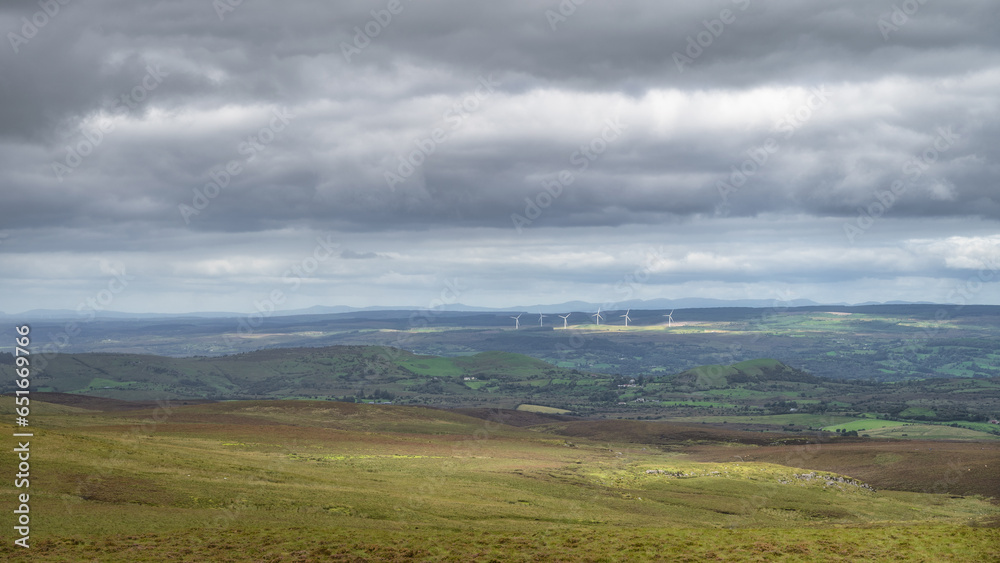 Several large wind turbines seen from Cuilcagh Boardwalk. Irish green wind energy generation. County Fermanagh, Northern Ireland Several large wind turbines seen from Cuilcagh Boardwalk. Irish green wind energy generation. County Fermanagh, Northern Ireland