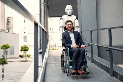 A robot carries a wheelchair with a sick man