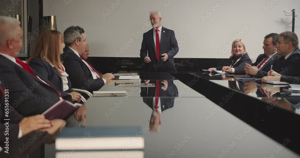 senior managers developing a strategy, CEO giving standing speech