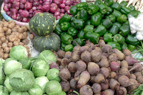 Cabbage and root vegetables in a market photo