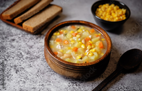 Fresh hot corn white bean potato soup in a bowl
