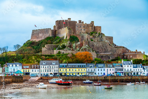 Mount Orgueil castle over the Gorey village promenade with yachts on the shore, Saint Martin, bailiwick of Jersey, Channel Islands, Great Britain photo