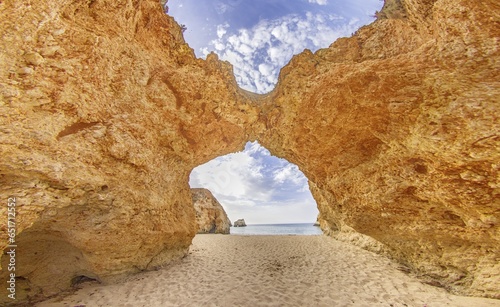 Panoramic picture between the cliffs at Praia do Prainha on the Portuguese Algarve coast during the day