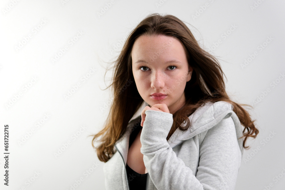 Girl with long blonde hair in white shirt poses in studio on white background. Model tests. Lovely girl with delicate facial features, tedious makeup. Wind is blowing hair. High quality 4k footage Girl with long blonde hair in white shirt poses in studio on white background. Model tests. Lovely girl with delicate facial features, tedious makeup. Wind is blowing hair. High quality 4k footage
