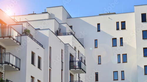 Modern luxury residential building. Modern apartment building on a sunny day. Facade apartment building  with a blue sky.  © Grand Warszawski
