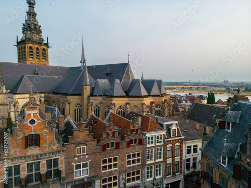 Nijmegen, the Netherlands. June 18th 2023. An aerial shot of the buildings around the Market Square and Stevenskerk church at sunrise.