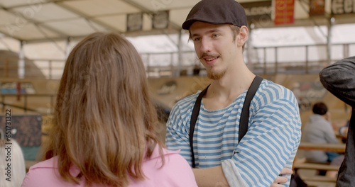 Guy with Blink reflex. Young man blinks during conversations, indicating nervous tic behavior associated with Tourette syndrome tics disorder, characterized by involuntary and repetitive movements. photo