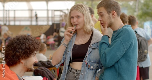 Portrait of modern young people. Vaping popular among youth alternative to smoking. Health risks and nicotine addiction are concerns. Lifestyle choice with ongoing debates and evolving regulations.