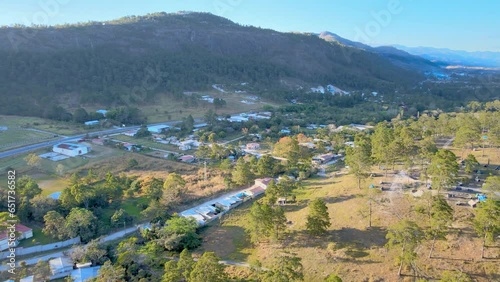 Aerial trip over a small town named Marcala with yellow sunset light photo