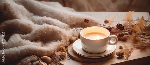 Autumn vibes with coffee sketchbook sweater and cozy lights from a top view photo