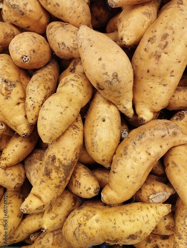Close-up photo of a pile of Cilembu sweet potatoes or Ipomoea batatas, which are sold in a supermarket. When baked, this sweet potato tastes very sweet, useful for maintaining blood sugar levels.