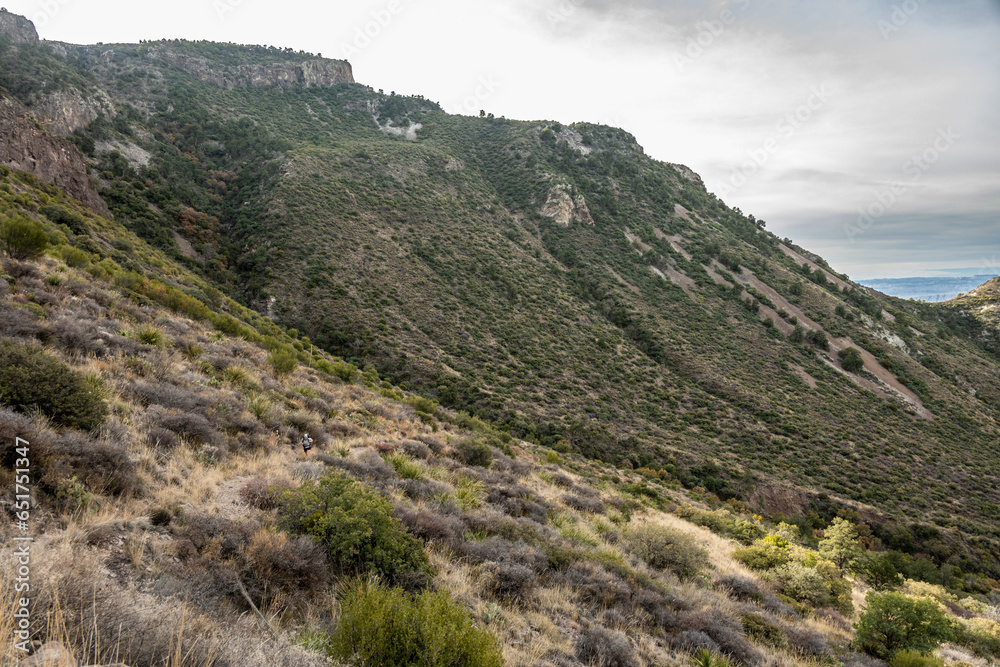 HIker Makes The Long Steep Climb Up Blue Creek Trail In Big Bend HIker Makes The Long Steep Climb Up Blue Creek Trail In Big Bend
