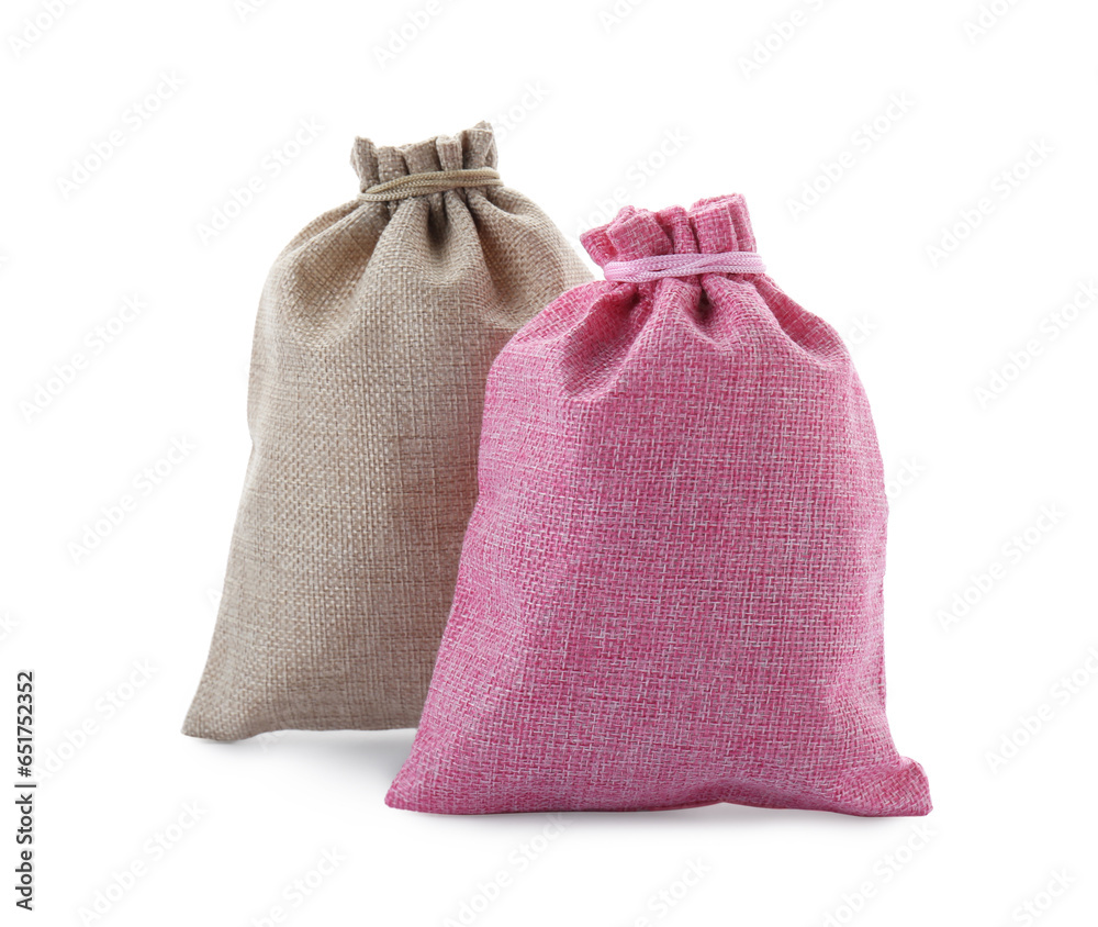 Two tied burlap bags isolated on white Two tied burlap bags isolated on white