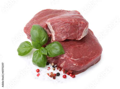 Fresh beef meat with basil leaves and spices isolated on white
