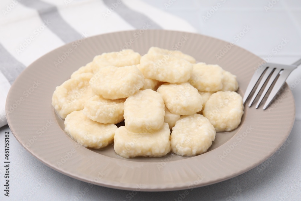 Plate of tasty lazy dumplings on white table, closeup Plate of tasty lazy dumplings on white table, closeup