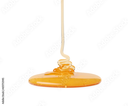 Pouring tasty natural honey isolated on white