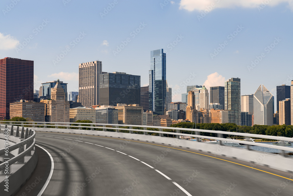 Empty urban asphalt road exterior with city buildings background. New modern highway concrete construction. Concept of way to success. Transportation logistic industry fast delivery. Chicago. USA. Empty urban asphalt road exterior with city buildings background. New modern highway concrete construction. Concept of way to success. Transportation logistic industry fast delivery. Chicago. USA.