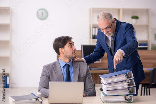 Two male colleagues working in the office