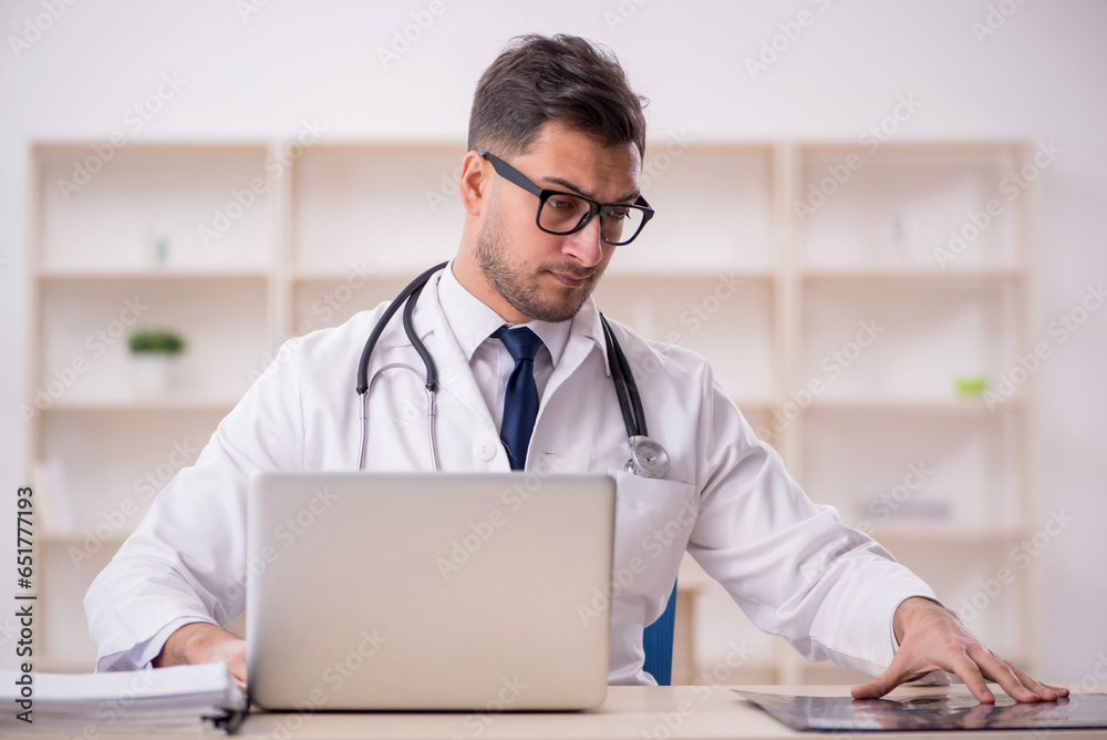 Young male doctor radiologist working in the clinic Young male doctor radiologist working in the clinic
