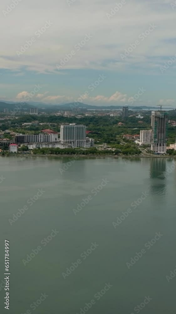 View of the city of Kota Kinabalu from the sea. Borneo, Sabah, Malaysia. View of the city of Kota Kinabalu from the sea. Borneo, Sabah, Malaysia.