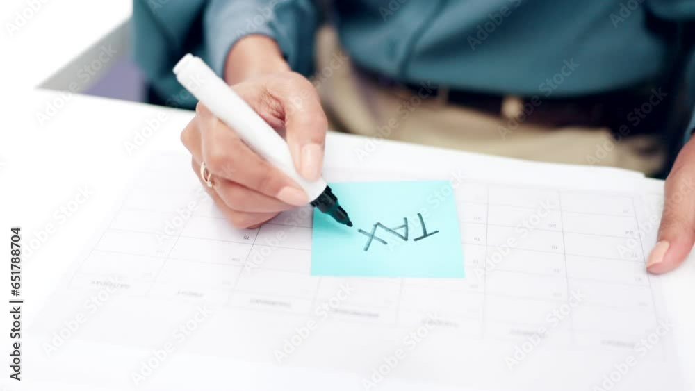 Reminder, writing and person with notes for tax payment, financial paperwork and budget planning. Calendar, business and hands with marker on sticky note to remember date, schedule and deadline Reminder, writing and person with notes for tax payment, financial paperwork and budget planning. Calendar, business and hands with marker on sticky note to remember date, schedule and deadline
