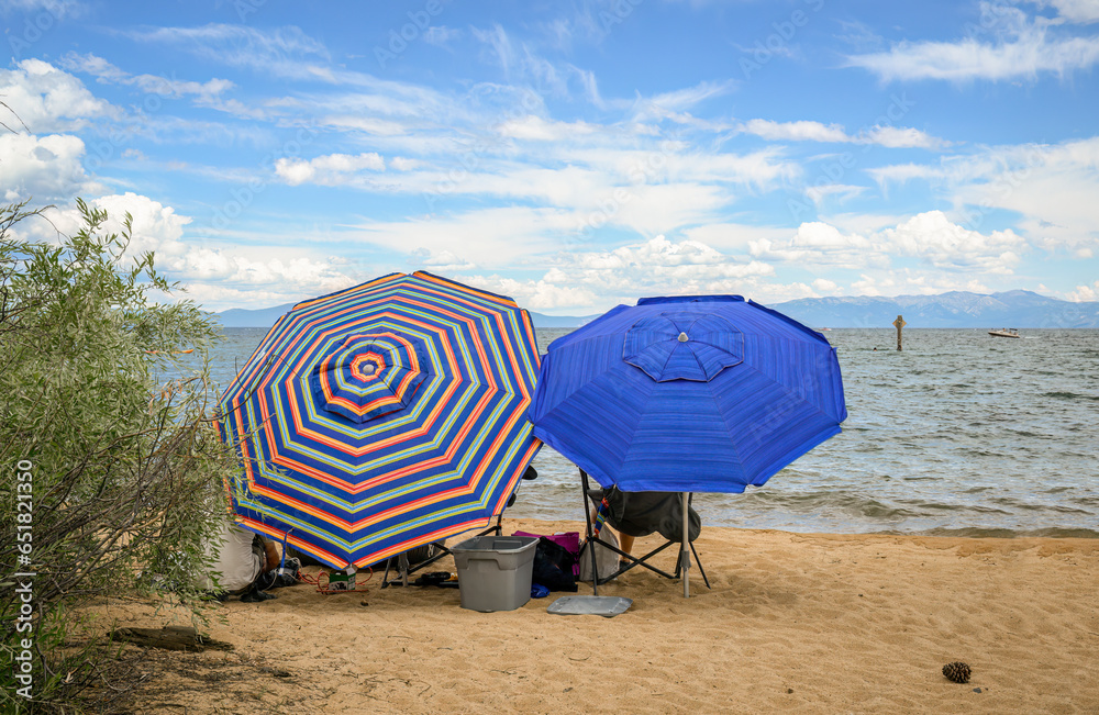 Colourful beach umbrellas on Pope Beach on a summer day. South Lake Tahoe. Colourful beach umbrellas on Pope Beach on a summer day. South Lake Tahoe.