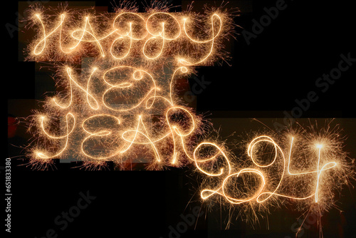 Happy New Year 2024, written with sparklers
