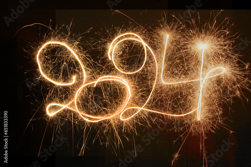 Happy New Year 2024, written with sparklers