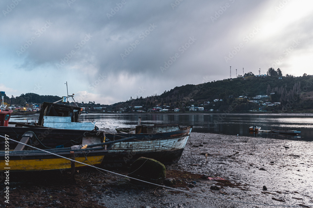 boats on the river on the island of chiloe
