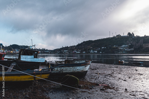 boats on the river on the island of chiloe