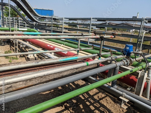 Pipe rack on the power plant industry water distribution system. The photo is suitable to use for industry background photography, power plant poster and electricity content media.