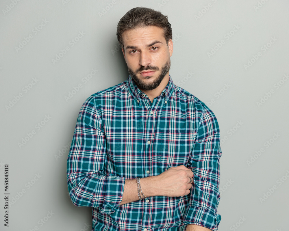 handsome casual man wearing checkered shirt and posing handsome casual man wearing checkered shirt and posing