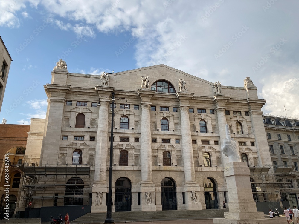 Colorful old buildings in Italy inside paintings and outside facades and rooftops views in the holiday summer, sunny blue sky day. Milan city center sightseeing big castle, tourists photographies.
