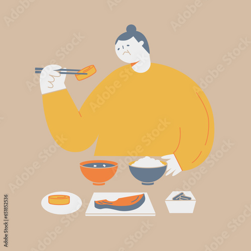 An elderly woman eating Japanese food. She has no appetite and looks troubled.