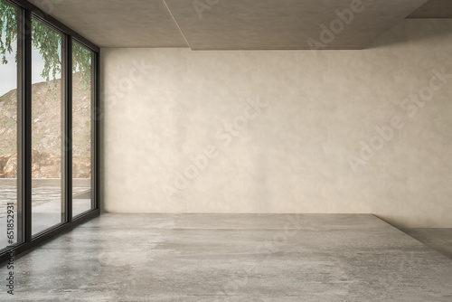 Empty room with beige wall and concrete floor.