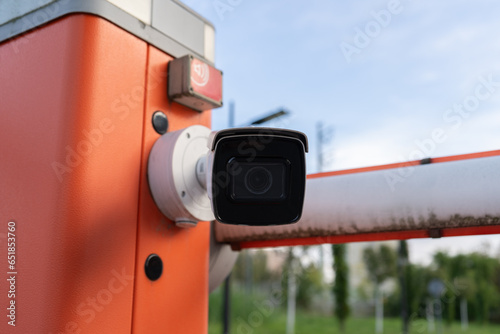 License plate reader, automatic number recognition, digital surveillance camera, boom barrier gate. Smart parking lot entrance pass automation. Vehicle access control. Car park identification system.