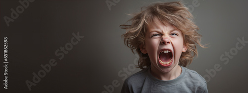 Angry and frustrated kid expresses emotions by screaming on a grey background. Banner cover design. Generative AI